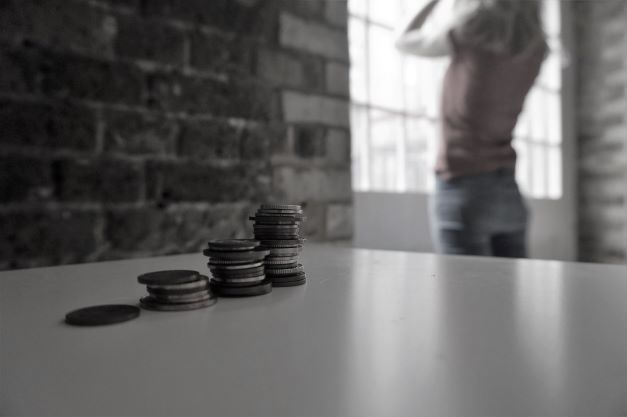 Black and white picture of woman and coins