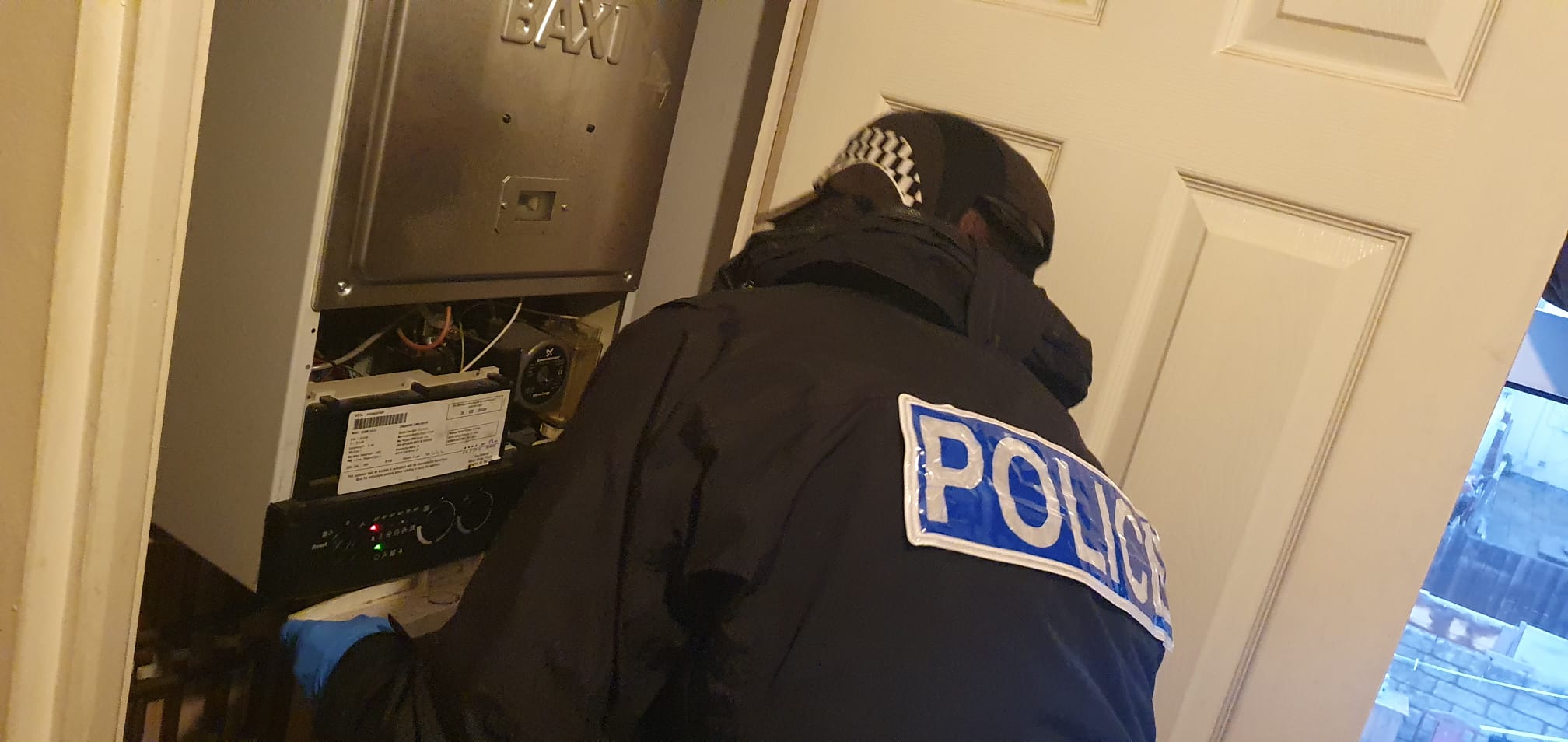 Police officer inspecting a possible brothel