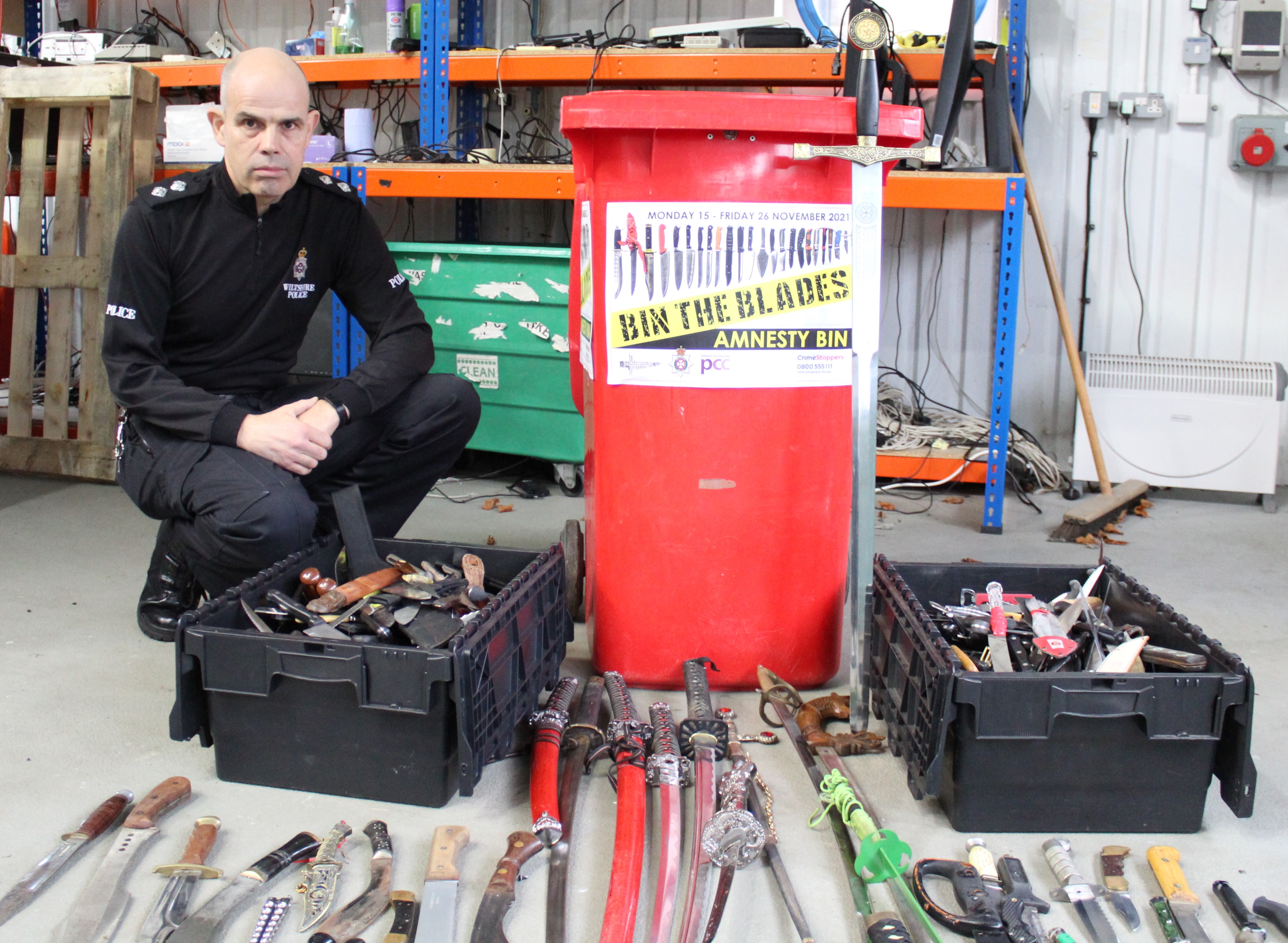 Inspector with knives and amnesty bin