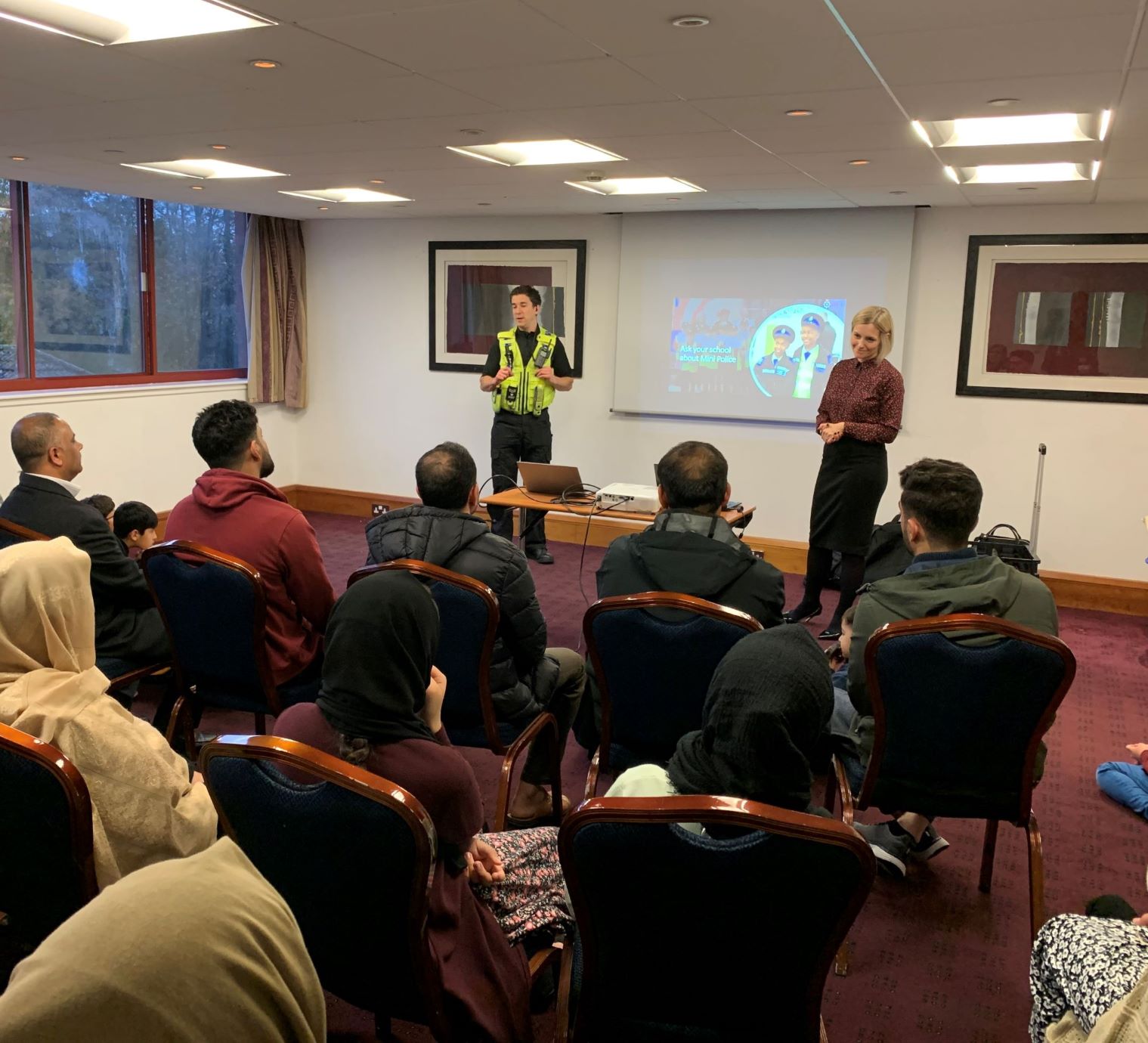 Officer speaking to group of refugees
