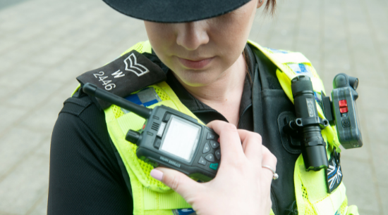 Female police officer using the radio