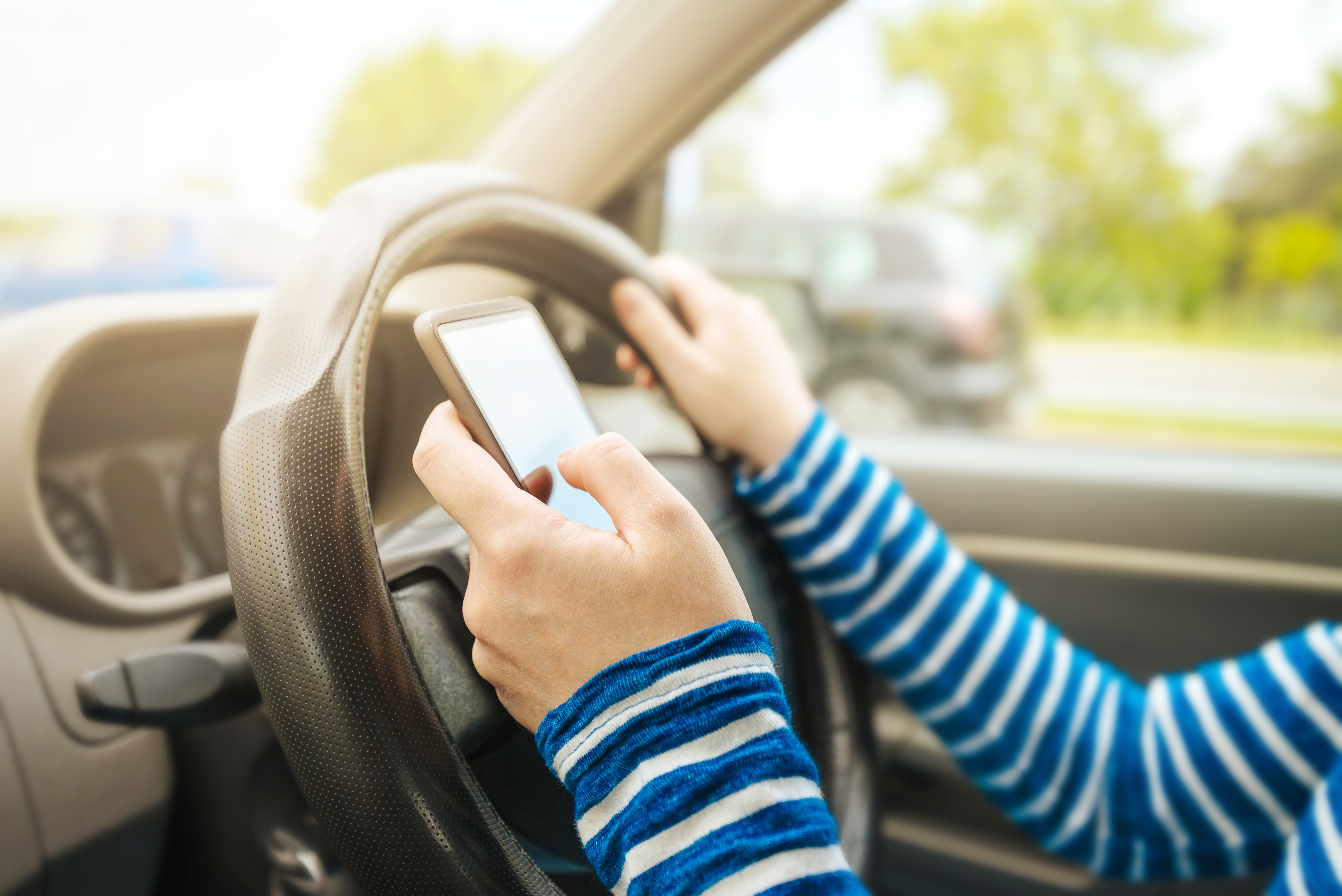 Using a hand-held phone while driving can get you a £200 fine and 6 points on your licence from 25 March 2022