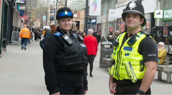 PCSO and Police Officer standing in Swindon town centre