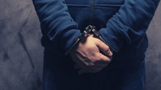 Hands in handcuffs