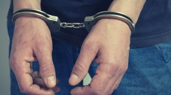 Image of hands in handcuffs