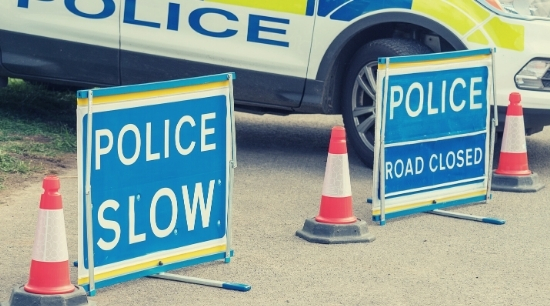 stock image of police road closed signs