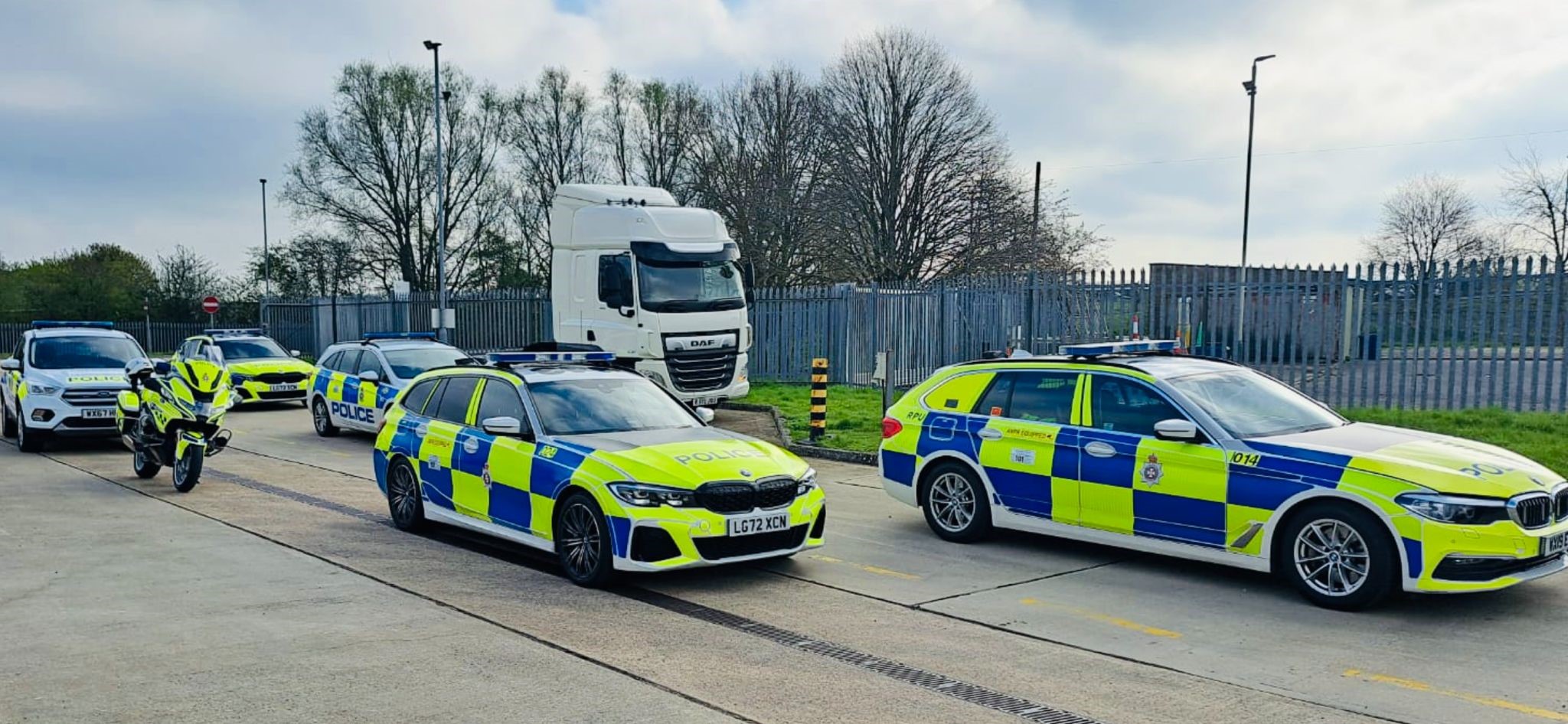 Unmarked HGV and police cars lined up for Op Tramline